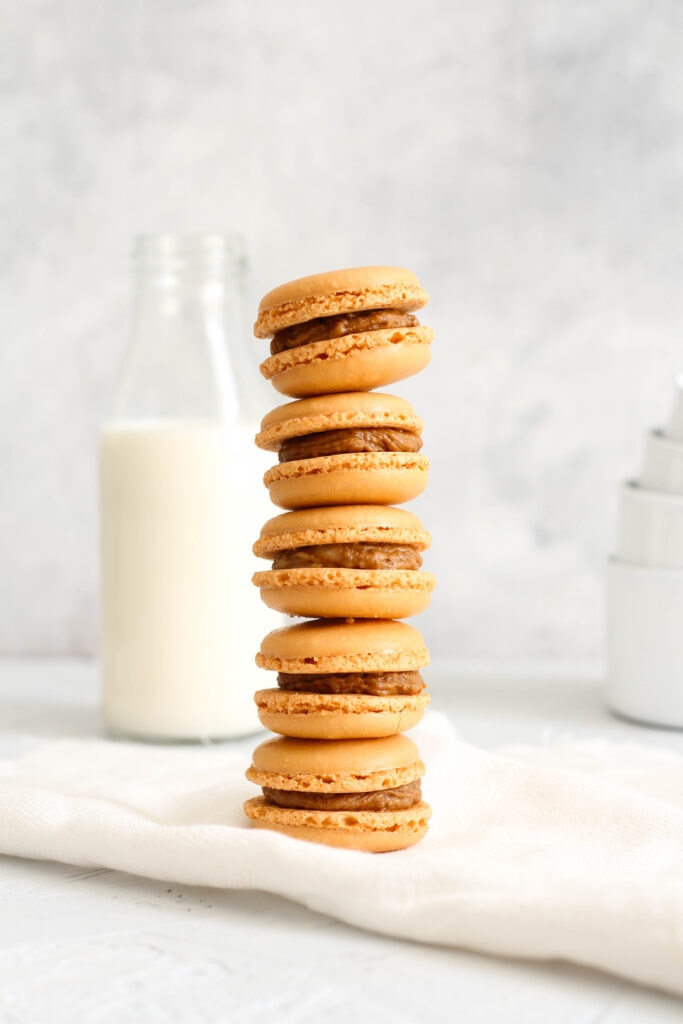 tall biscoff macaron stack with milk bottle in the backgrounf