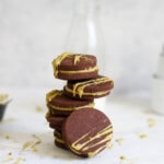 Chocolate cookies with pistachio ganache filling and milk bottle