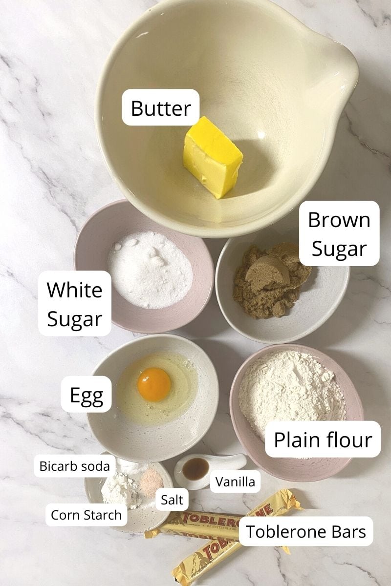 Ingredients laid out in bowls of toblerone cookies.