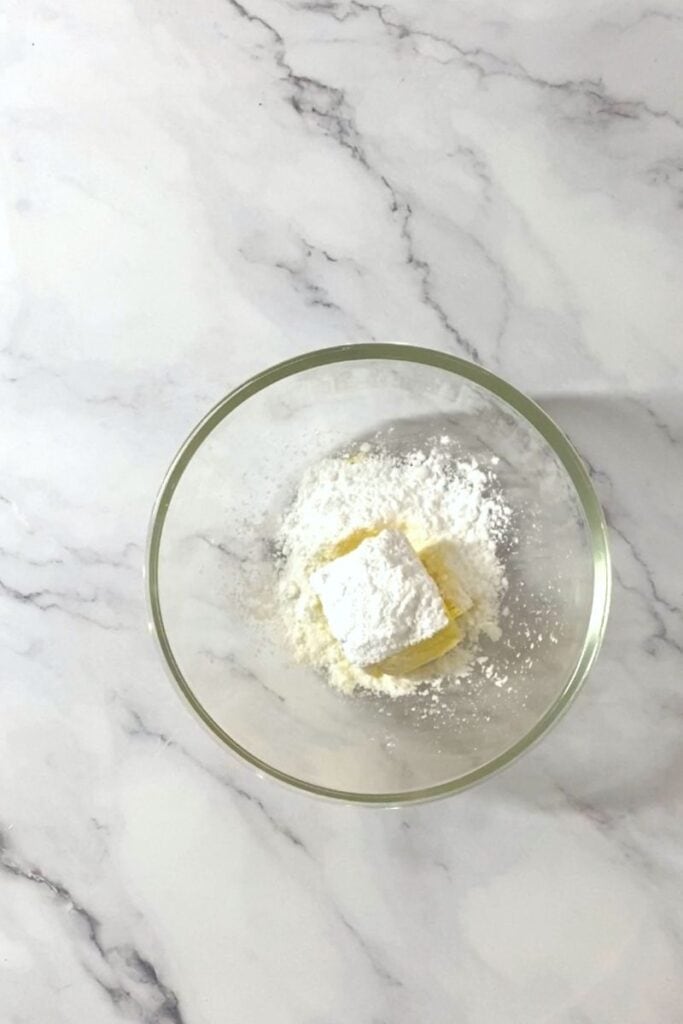 Butter and powdered sugar in bowl.