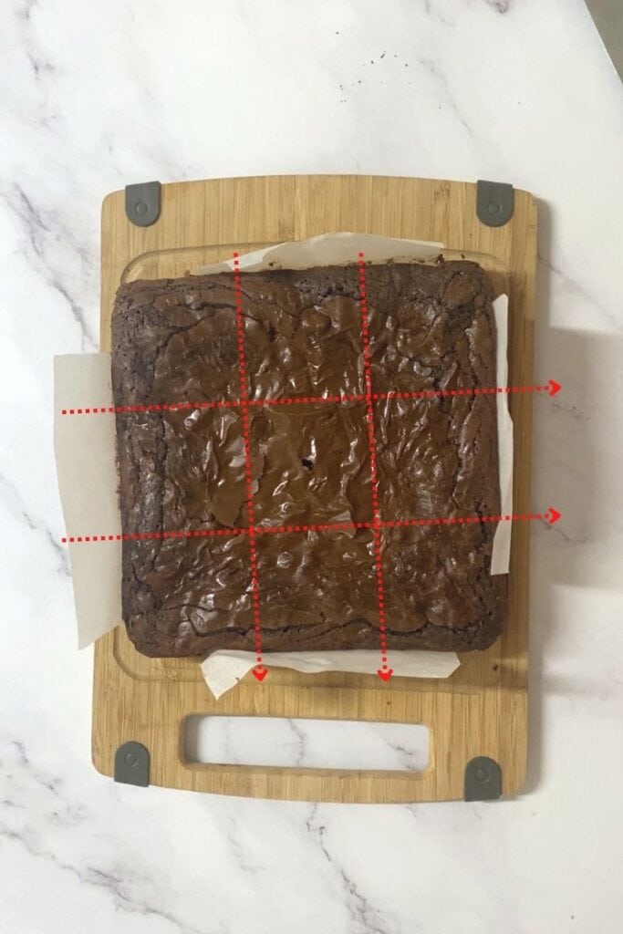 How to cut brownie into triangles, marked with 2 lines horizontal, and 2 vertical.