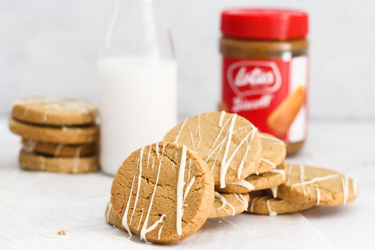 Biscoff Shortbread Cookies with lotus biscoff spread in the background.