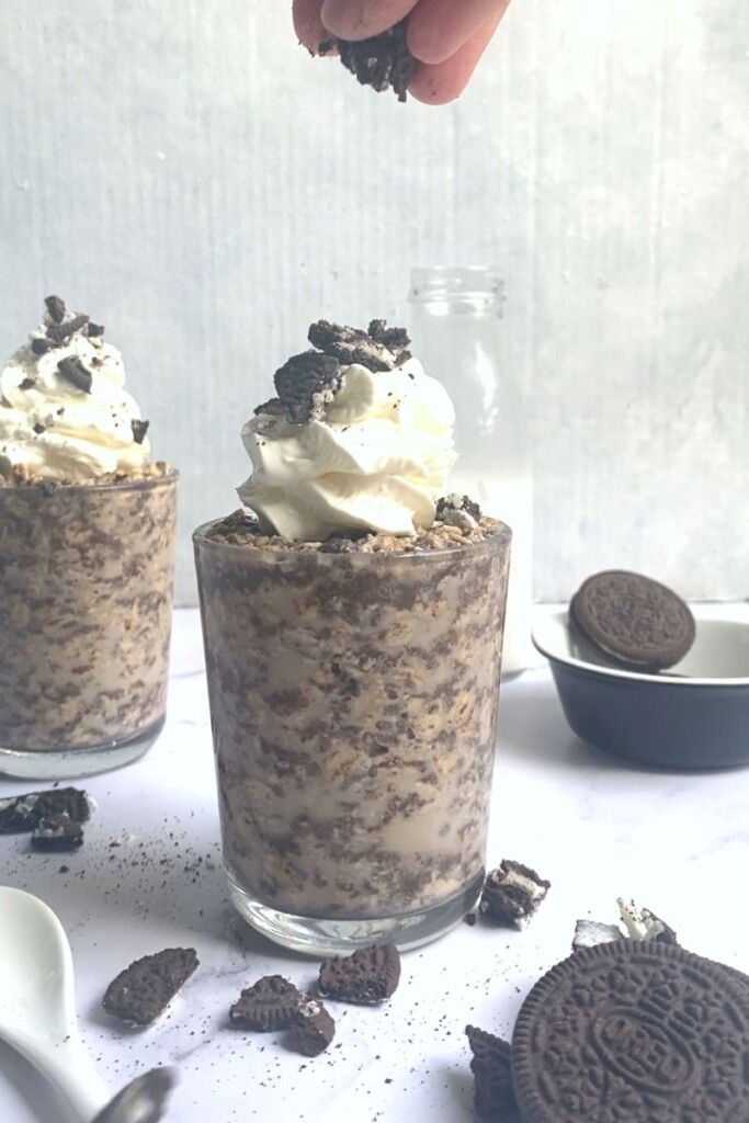Oreo overnight oats topped with cookies and cream.