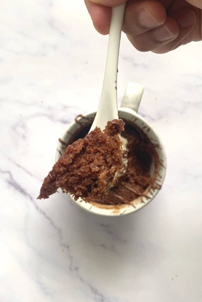 Spoon out of nutella mug cake.