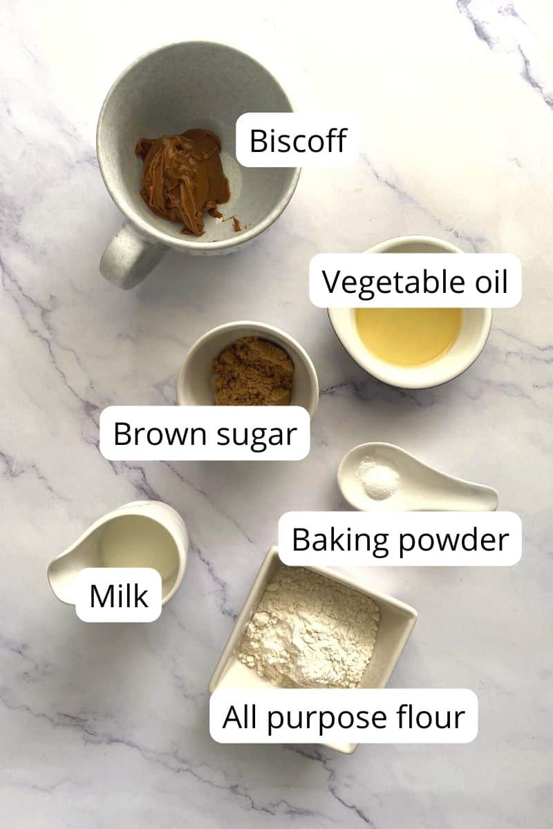 Ingredients of biscoff mug cake in bowls.