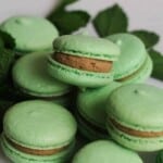 Close up of Choc Mint Macaron on top of other Mint Macarons.
