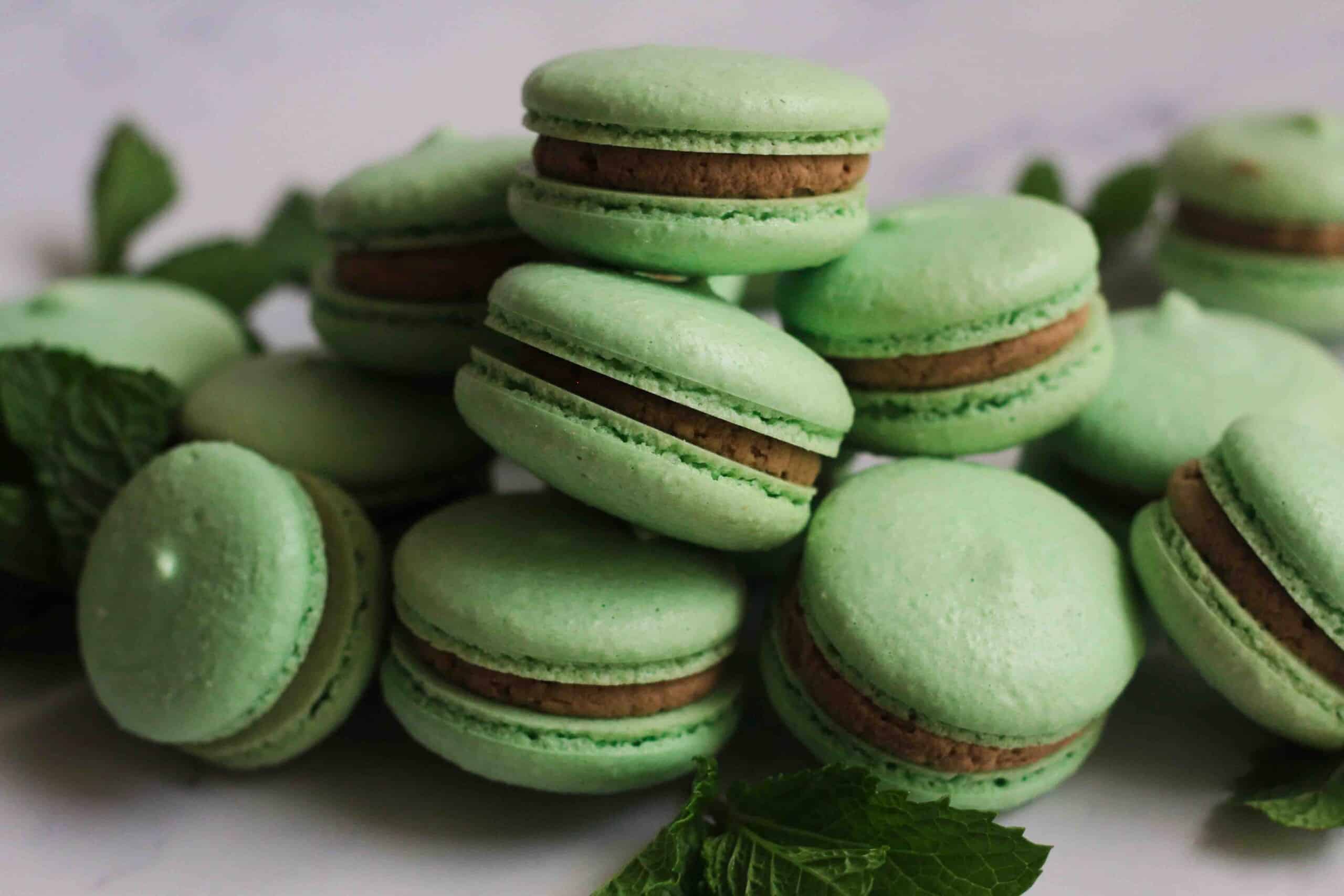 Chocolate Mint Macarons stacked on each other.
