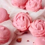 Rose macarons with a close up in the middle.