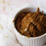 Close up shot of Biscoff oats in a white bowl to the right of the screen.